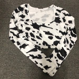 It’s a cow print long sleeve belly shirt. It’s brand new.